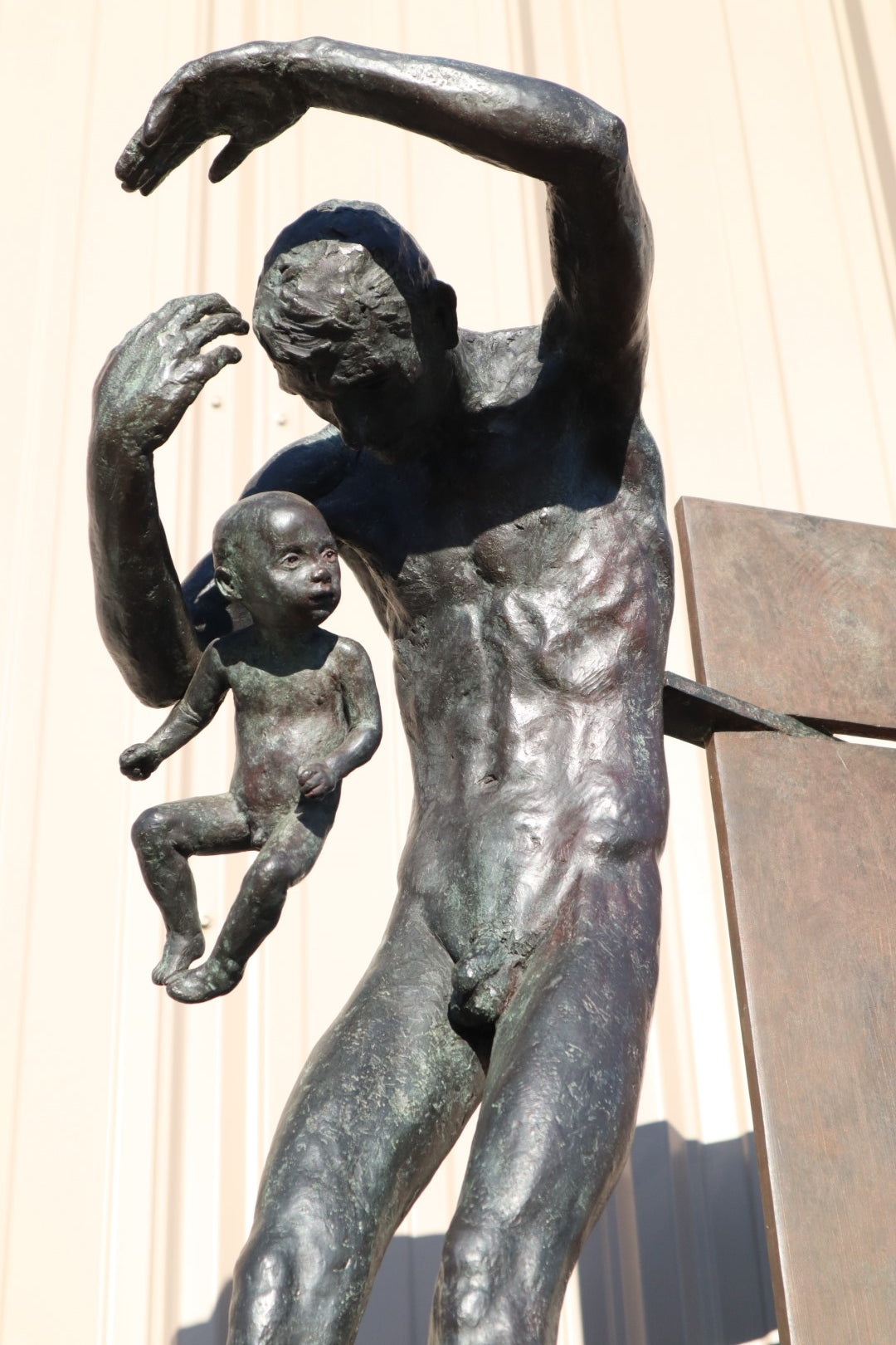 TREVOR SOUTHEY BRONZE SCULPTURE, "FATHERHOOD", DEPICTION OF MAN WITH INFANT, BRONZE AND STEEL, WITH BASE