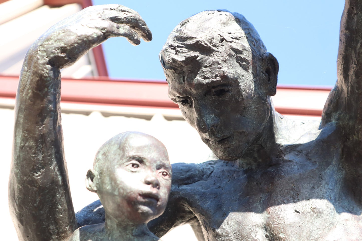 TREVOR SOUTHEY BRONZE SCULPTURE, "FATHERHOOD", DEPICTION OF MAN WITH INFANT, BRONZE AND STEEL, WITH BASE