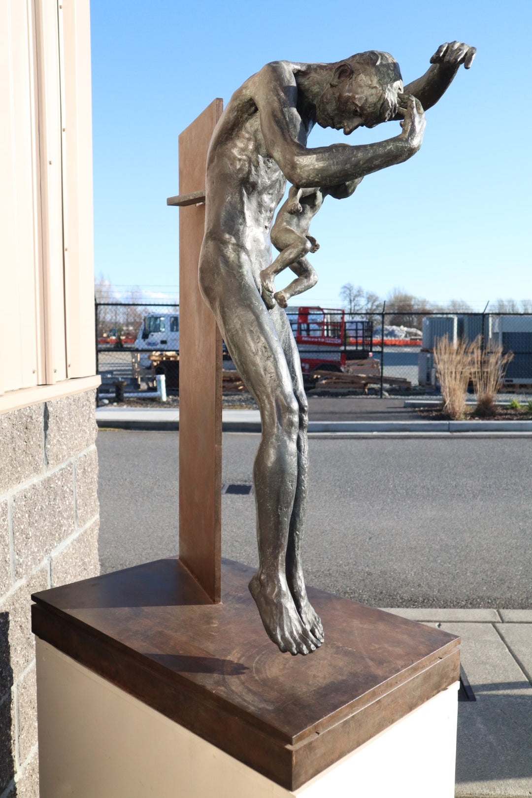 TREVOR SOUTHEY BRONZE SCULPTURE, "FATHERHOOD", DEPICTION OF MAN WITH INFANT, BRONZE AND STEEL, WITH BASE