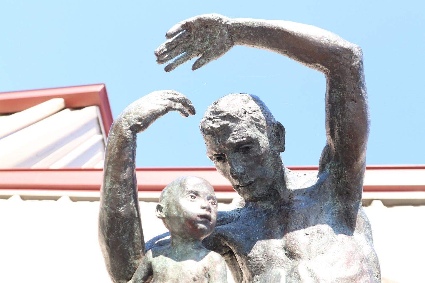 TREVOR SOUTHEY BRONZE SCULPTURE, "FATHERHOOD", DEPICTION OF MAN WITH INFANT, BRONZE AND STEEL, WITH BASE
